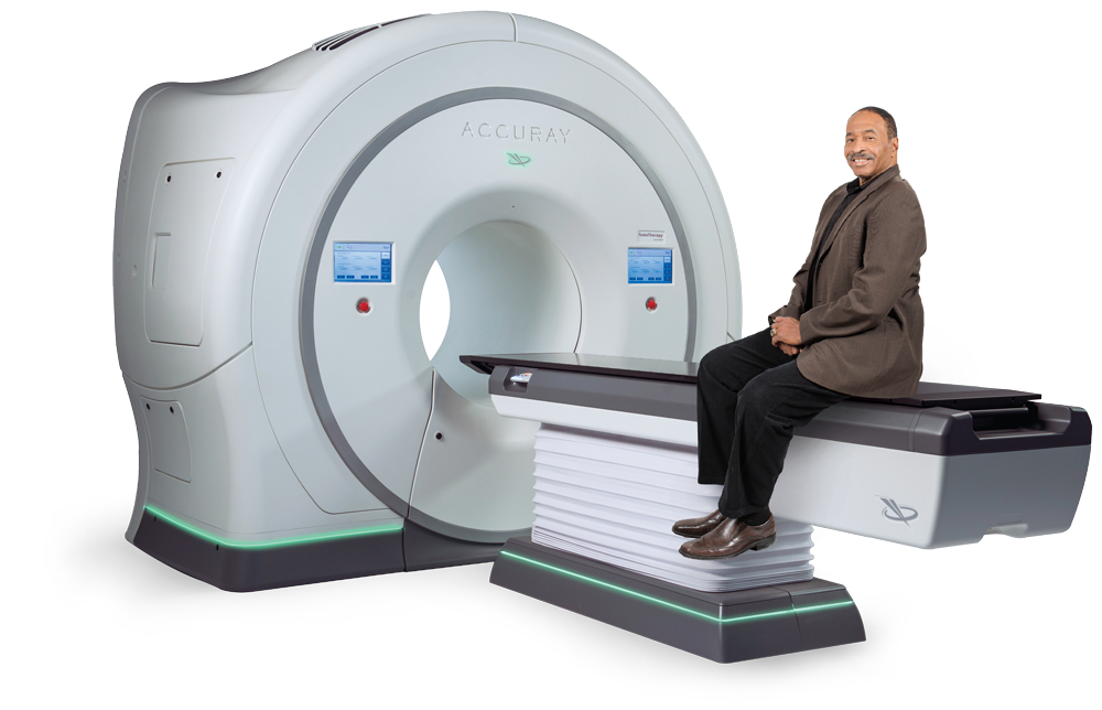 Image of a patient sitting on the TomoTherapy system from Accuray